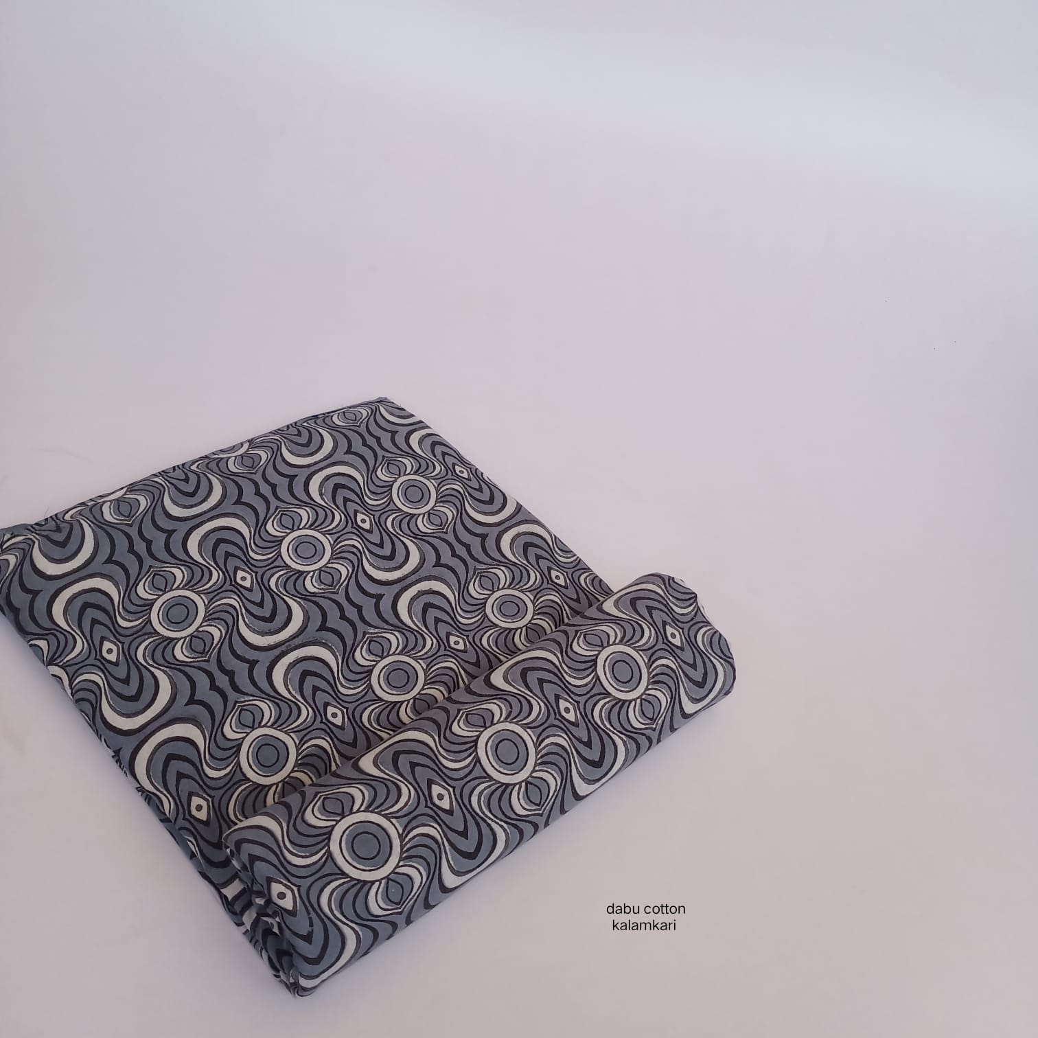 Grey abstract-pattern Dabu cotton handblock fabric, ethically crafted for wholesale buyers.